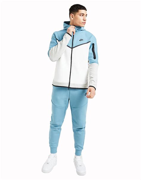 blue nike tech tracksuit